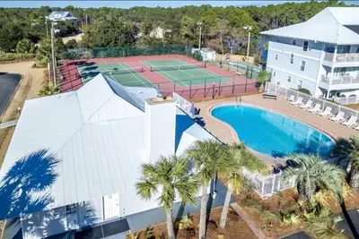 an aerial view of a tennis court and a tennis court at Beachside Villas 412 in Santa Rosa Beach