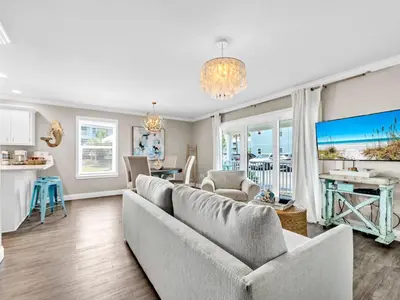 a living room with a couch and a table at Beachside Villas 214 in Santa Rosa Beach