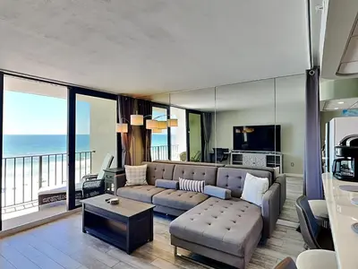 a living room with a couch and a table at Edgewater Tower III #709 in Panama City Beach