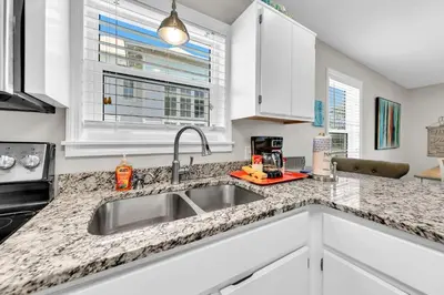 a kitchen with a sink and a window at Beachside Villas 823 in Santa Rosa Beach