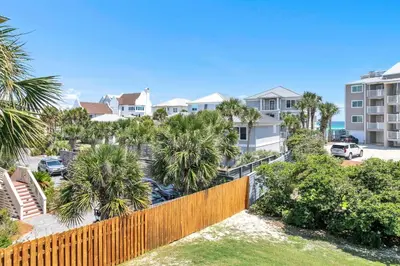 a view of a residential neighborhood with palm trees and houses at Beachside Villas 823 in Santa Rosa Beach
