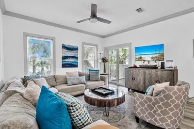 a living room with a couch and a table at Grouper Therapy in Santa Rosa Beach