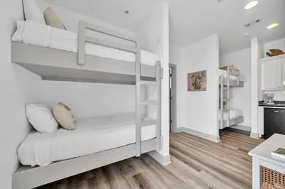 a small room with bunk beds in it at Grouper Therapy in Santa Rosa Beach