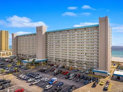 an aerial view of a hotel with a parking lot at The Summit Unit 1215 in Panama City Beach