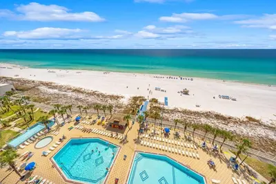an overhead view of a beach with two pools at The Summit Unit 1215 in Panama City Beach