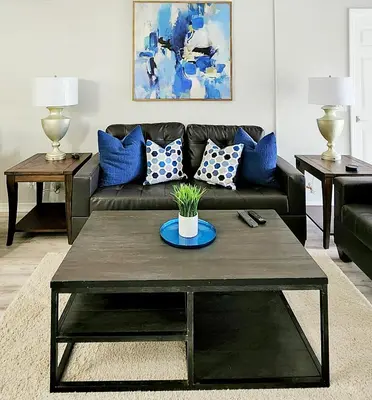 a living room with a couch and a coffee table at Blue By The Bay in Panama City Beach