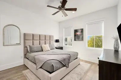 a bedroom with a bed and a ceiling fan at Casa DAzure by Travel Life Vacations in Santa Rosa Beach
