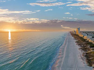 a view of the beach at sunset at Majestic View by Travel Life Vacations in Santa Rosa Beach