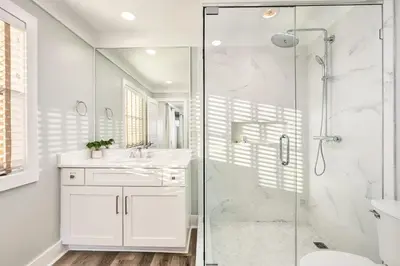 a white bathroom with a shower and a sink at Majestic View by Travel Life Vacations in Santa Rosa Beach