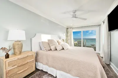 a white bedroom with a bed and a window at Majestic View by Travel Life Vacations in Santa Rosa Beach