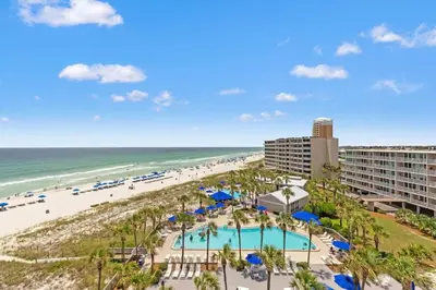 a view of the beach from the balcony of a resort at Dunes of Panama C605 in Panama City Beach