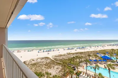 a view of the beach from the balcony of a resort at Dunes of Panama C605 in Panama City Beach