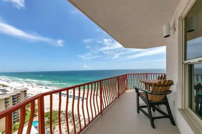 a balcony with a table and a view of the beach at Hidden Dunes 1605 in Panama City Beach