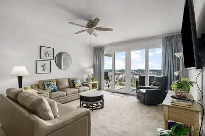 a living room with a couch and a ceiling fan at Laketown Wharf #0830 in Panama City Beach