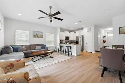 a living room with a couch and a ceiling fan at Panama City Beach Cozy Townhouse in Panama City Beach