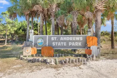 a sign for the st andrews state park at Commodore 1009 in Panama City Beach
