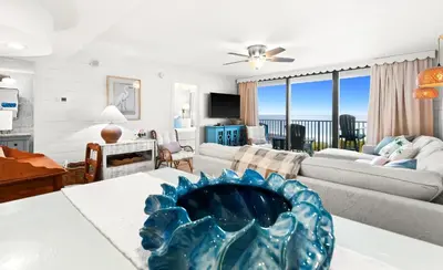a living room with a view of the ocean at One Seagrove Place 0204 in Santa Rosa Beach