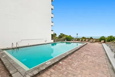 a swimming pool on the side of a building at One Seagrove Place 0502 in Santa Rosa Beach