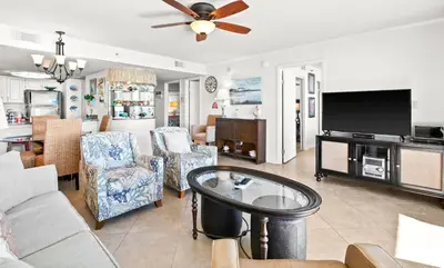 a living room with a couch and a tv at One Seagrove Place 0502 in Santa Rosa Beach