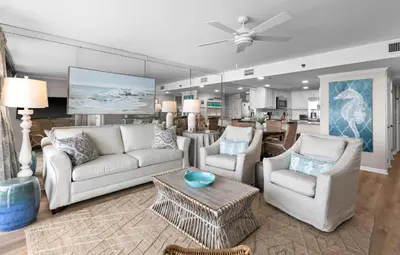 a living room with two couches and a table at One Seagrove Place 0904 in Santa Rosa Beach