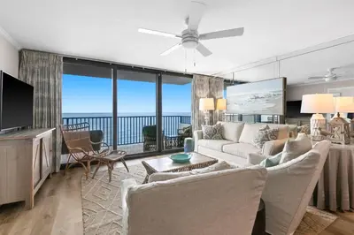 a living room with a couch and a tv at One Seagrove Place 0904 in Santa Rosa Beach