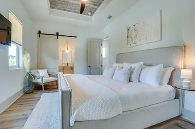 a bedroom with a large white bed with white pillows at No Bad Day on 30A in Inlet Beach