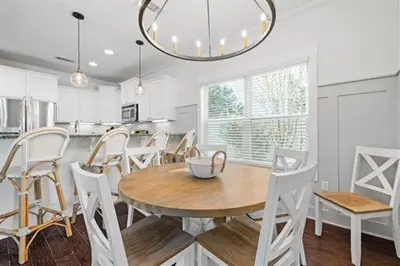 a kitchen and dining room with a table and chairs at Beach Bliss in Inlet Beach
