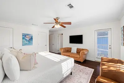 a living room with a couch and a ceiling fan at Beach Bliss in Inlet Beach