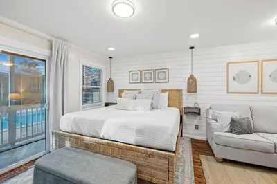 a bedroom with a bed and a couch at Grandy 30A in Inlet Beach