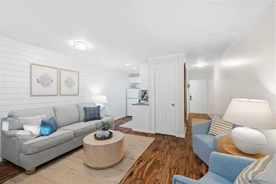 a living room with a couch and a table at Grandy 30A in Inlet Beach