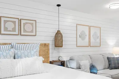a bedroom with a bed and a couch at Grandy 30A in Inlet Beach