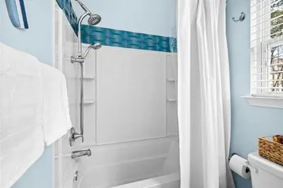 a bathroom with a shower and a white tub at Inlet Love in Inlet Beach