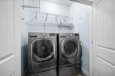a laundry room with a washer and dryer at Inlet Love in Inlet Beach