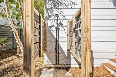 a wooden fence on the side of a house at Soakin it Up in Inlet Beach