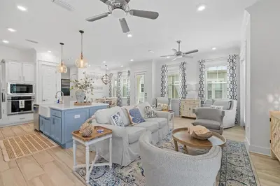 a living room with a couch and a table at Heron's Nest in Inlet Beach