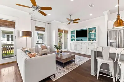 a living room with a couch and a table at Island Lullaby in Inlet Beach