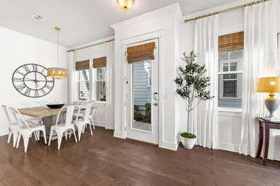 a dining room with a table and chairs at Island Lullaby in Inlet Beach