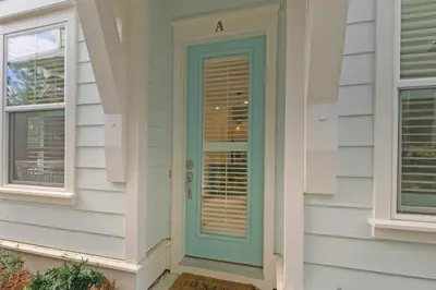 a door on the side of a house at Lucky Beach in Inlet Beach