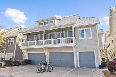 a house with two bikes parked in front of it at Amen 30A in Inlet Beach