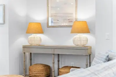 two lamps sitting on top of a table in a bedroom at Kelly's Cabana in Inlet Beach