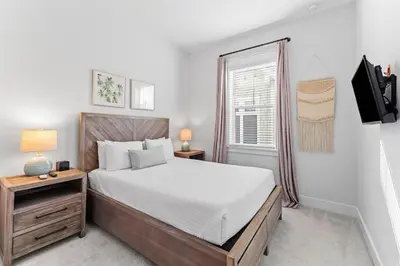 a bedroom with a bed and a window at Kelly's Cabana in Inlet Beach