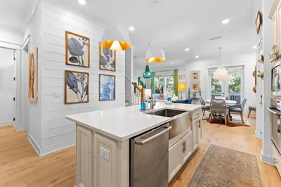 a kitchen with a sink and a counter top at Coco Cottage in Inlet Beach
