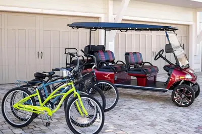 a group of bikes parked next to a golf cart at Beachwood Hideaway in Inlet Beach