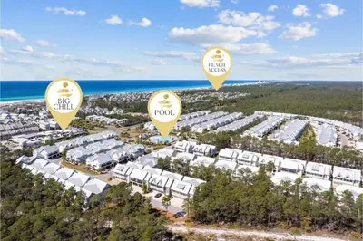 an aerial view of a large apartment complex with the ocean at Forever Grateful in Inlet Beach