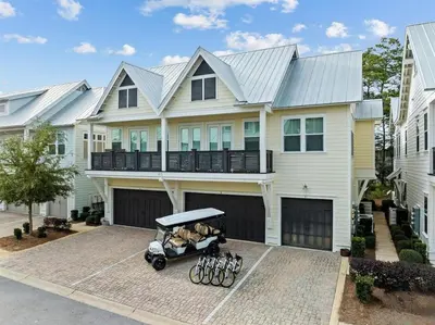a house with a stroller in front of it at License to Chill in Inlet Beach