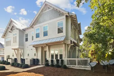 a white house with a gambrel roof at Sand Dollar Dream in Inlet Beach