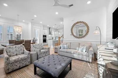 a living room with a couch and a table at Doc's House in Inlet Beach
