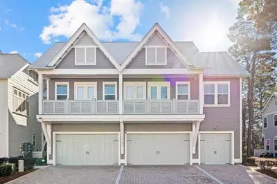 a large house with a pink at Doc's House in Inlet Beach