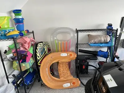 a organized room with a toy hose and other items at Doc's House in Inlet Beach