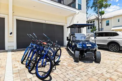 a group of bikes parked next to a golf cart at SaltLife30A in Inlet Beach